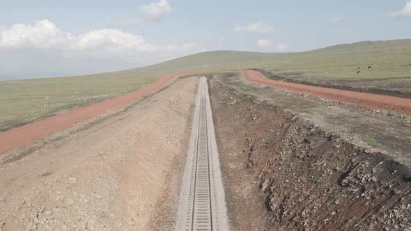 Moving along railroad tracks. Aerial view of Railroad emergency stop track in Trialeti, Georgia alt
