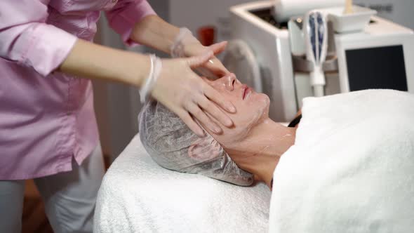 Beautician Prepares Laser Rejuvenation Facial Hair Removal Woman in Beauty Salon alt
