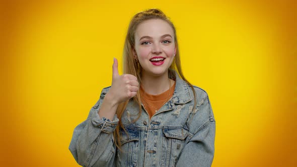 Teenager Girl Raises Thumbs Up Agrees or Gives Positive Reply Recommends Advertisement Likes Good alt