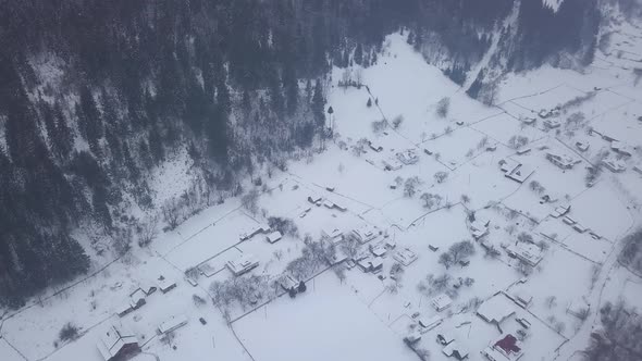 village Kryvorivnia covered with snow in the Carpathians mountains alt
