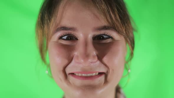 Close-eyed girl close up, girl squinted to the tip of her nose alt