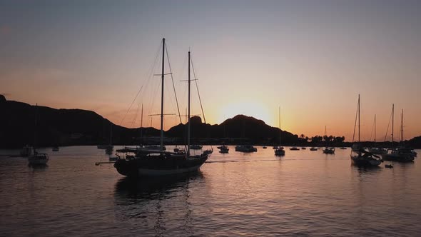 Aerial View on Seashore of Lipari Island. Mountains and Colorful Sky. Moored Vessels. Mediterranean alt
