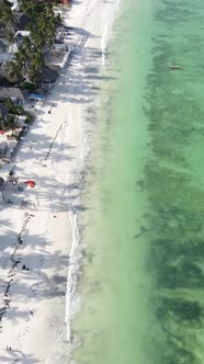 Vertical Video Boats in the Ocean Near the Coast of Zanzibar Tanzania alt