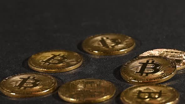 Golden bitcoin physical coins fall and bounce