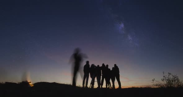 Adult Friends Stargazing Together at Night alt