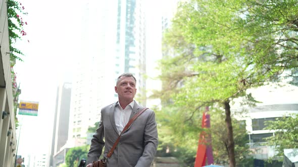 businessman with a bicycle to working in the city downtown, business work new normal urban lifestyle