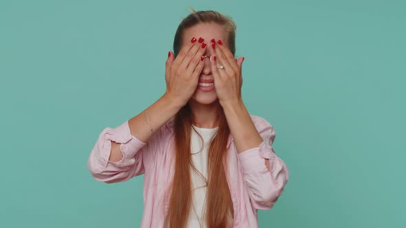 Curious Teenager Young Girl Closing Eyes with Hand and Spying Through Fingers Hiding and Peeping alt