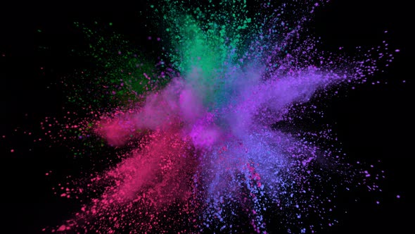 Super Slowmotion Shot of Color Powder Explosion Isolated on Black Background alt