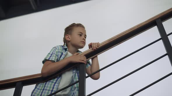 Curious Schoolboy Standing Stairway Alone alt