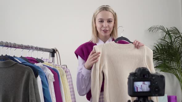 A Female Stylist Shows and Talks About Handmade Clothes in Front of the Camera