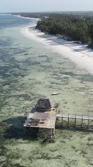 Tanzania  Vertical Video House on Stilts in the Ocean on the Coast of Zanzibar Slow Motion alt