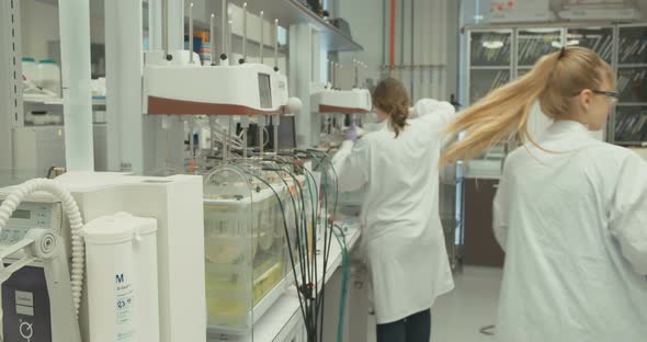Scientist working in a pharmaceutical laboratory conducting experiments alt