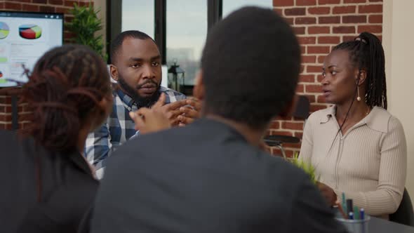 Team of Office Workers Attending Briefing Meeting to Discuss Project alt