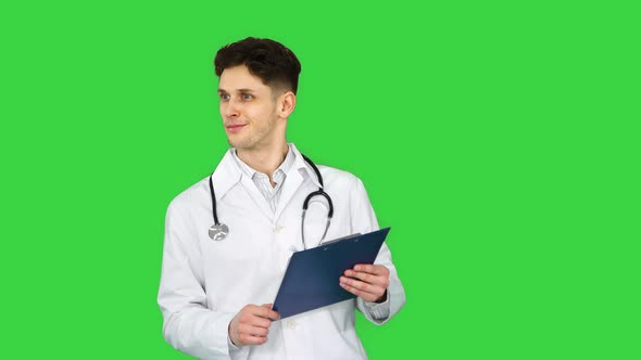 Doctor Dancing Holding Tablet with Documents on a Green Screen, Chroma Key alt