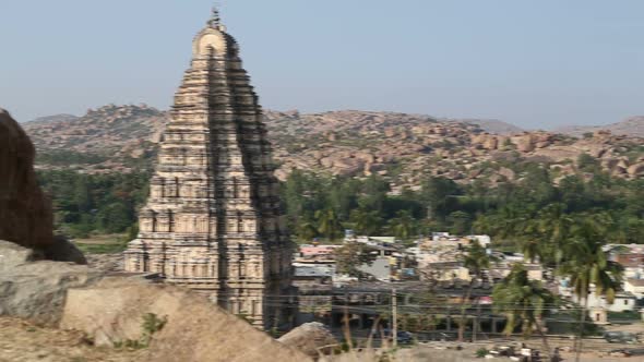View of the village and famous Virupaksha Temple in Hampi. alt
