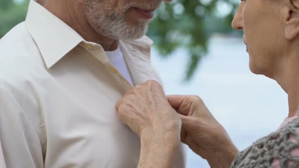 Beautiful Aged Lady Caring About Her Handsome Husband, Love and Tenderness alt