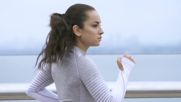 Brunette woman running.