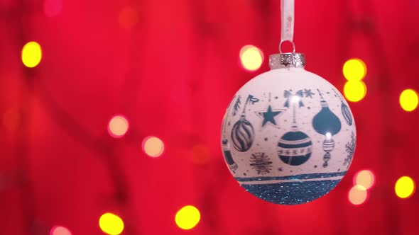 White New Year Ball Toy and Blinking Garland with Round Defocused Lights alt