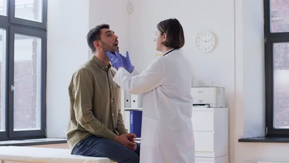 Doctor Checking Lymph Nodes of Patient at Hospital