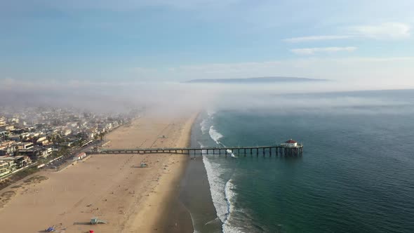 Manhattan Beach Pier On A Cloudy Day In California, USA - aerial drone shot alt