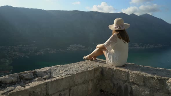 A Girl Looks From the Heights To the Boka Bay of Kotor