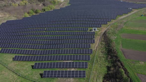 Solar panel produces green, environmentaly friendly energy. Aerial view from drone alt