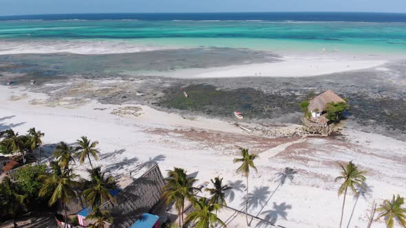 The Rock Restaurant in Ocean Built on Stone at Low Tide on Zanzibar Aerial View alt