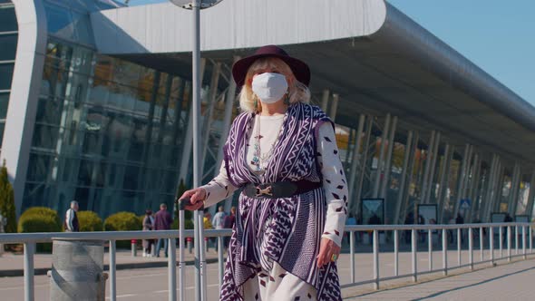 Senior Pensioner Tourist Grandmother Wearing Protective Face Mask Avoid Coronavirus Near Airport alt