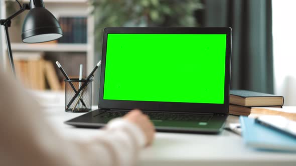 Woman Using Green Screen Laptop