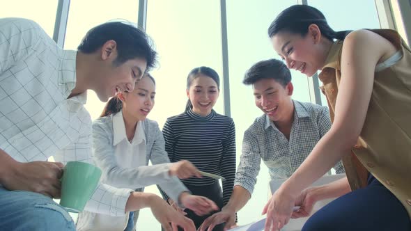 Group of asian young creative happy people entrepreneur on a business meeting alt