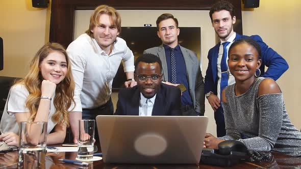 Group Of Multi-Ethnic Startup Entrepreneur Smiling and Looking at Camera, Dolly Shot.