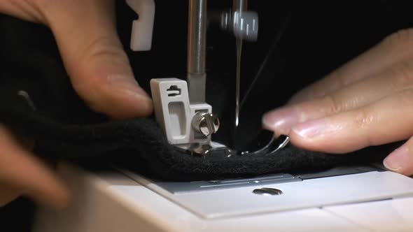 Closeup of Sewing Machine Needle Rapidly Moves Up and Down alt