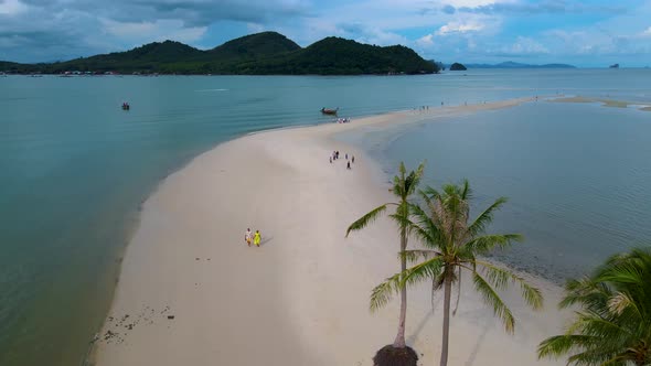 Couple Men and Women Walking on the Beach at the Island Koh Yao Yai Thailand Beach with White Sand alt