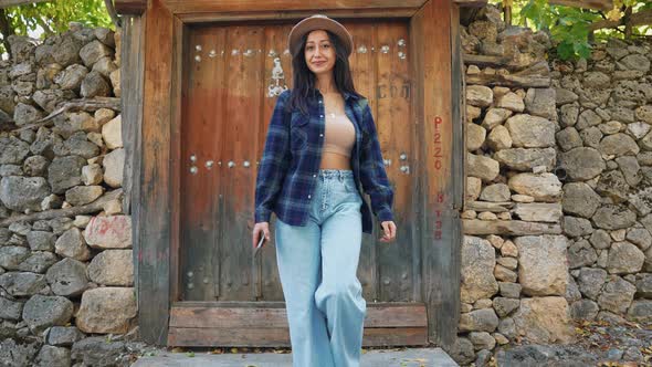 Traveller Woman in Front of Historical Door alt
