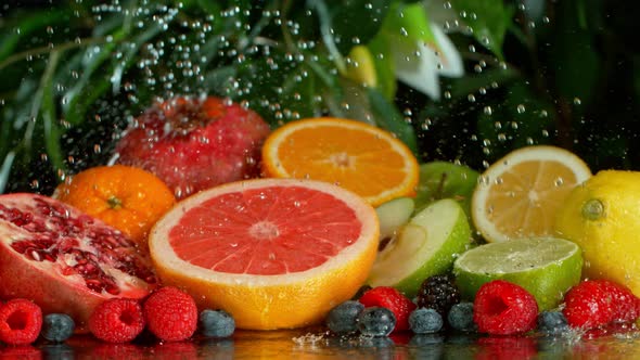 Super Slow Motion Shot of Pouring Water on Variation of Fruits at 1000Fps alt