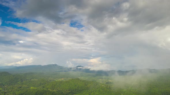 Rainbow after the rain over the forest. clouds time lapse.