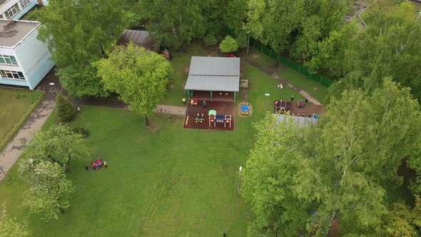 Children Play on the Playground in Kindergarten in Summer Aerial View