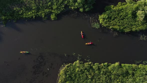 Top View of the Svisloch River Kayakers Floating on the River in the City's Loshitsky Park at Sunset alt