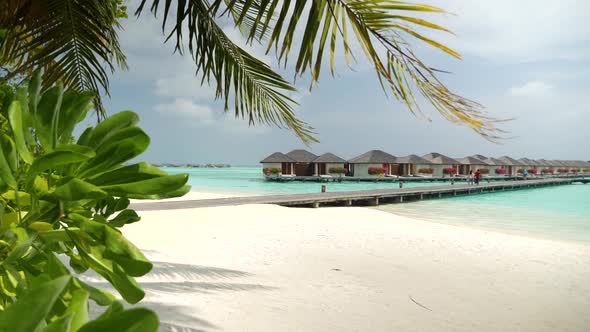 Luxury Overwater Villas on Turquoise Lagoon White Sandy Beach in Maldives alt