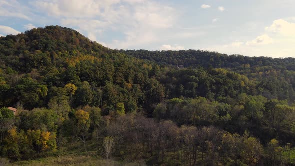 Aerial view of mountain in western Wisconsin with prayer chapel hiding in woods.