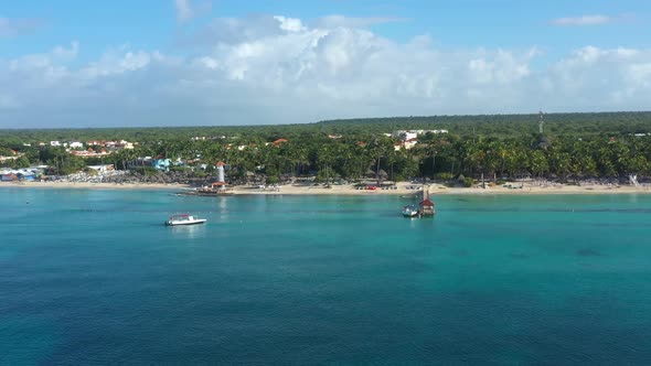 Dominicus Beach at Bayahibe with Caribbean Sea Sandy Seashore Lighthouse and Pier alt