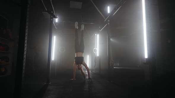 Sporty Woman is Performing Hands Walking in Fitness Center Training Alone in Gymnastics Hall alt