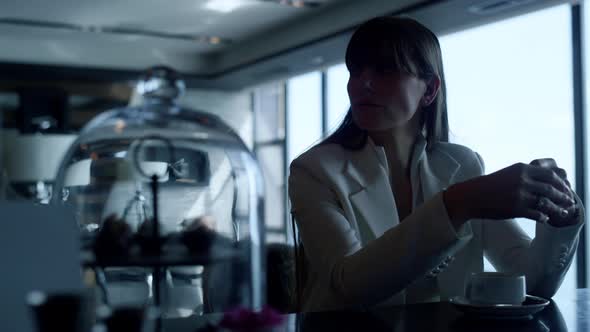 Closeup Sad Businesswoman Drinking Espresso Alone alt