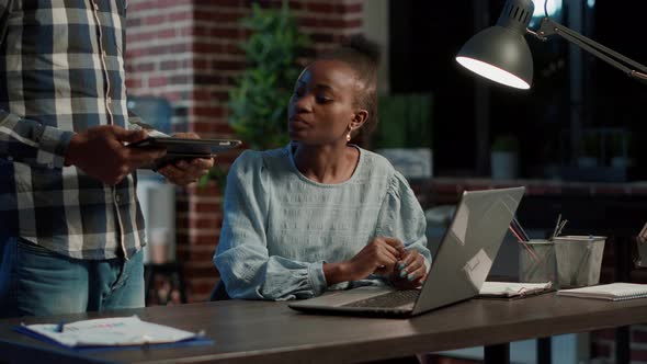 Business Team Using Digital Tablet and Laptop to Discuss Trade Strategy alt