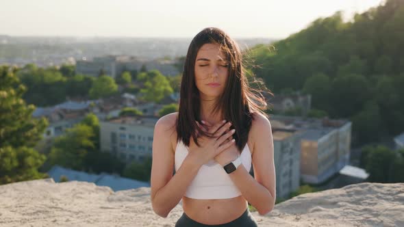 Portrait of Beautiful Yoga Woman on Hill