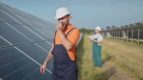 An Employee of a Power Plant Transmits Commands By Walkietalkie alt