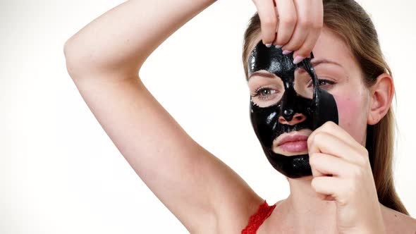 Girl Removes Black Mask from Face