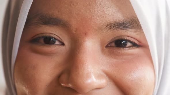 Eyes of Muslim Woman Smiling to the Camera Face Closeup Portrait