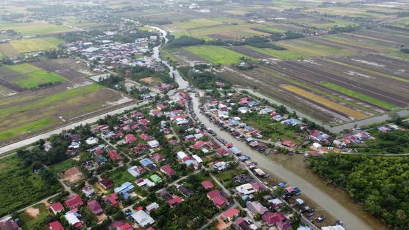 Aerial view fishing village and kampung house beside the river alt