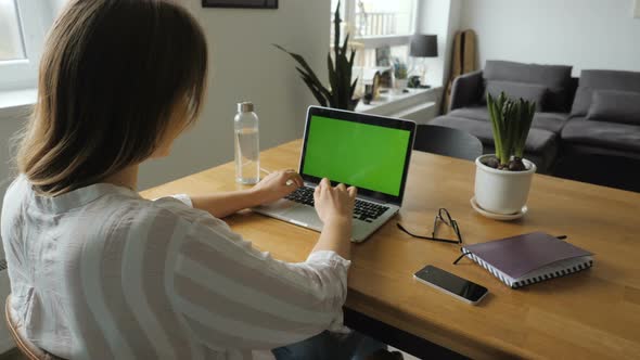Woman Working With Green Screen Laptop